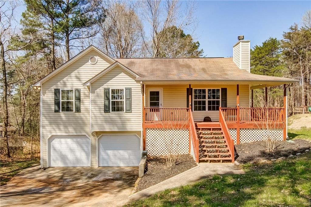 a view of a house with wooden fence