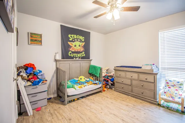 a room with toys and a dresser