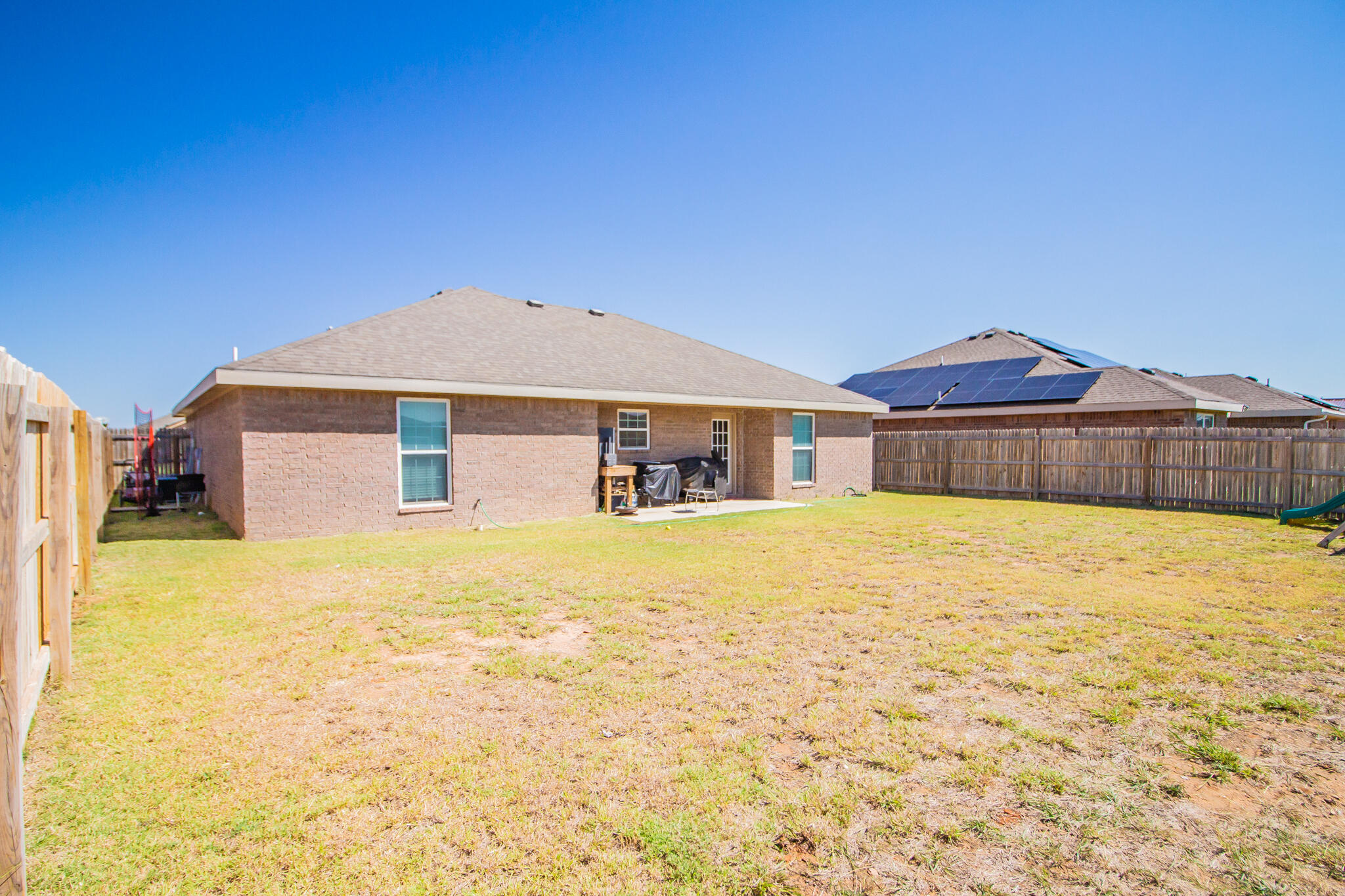8805 15th Street Lubbock, TX 79416 - Photo 17 of 20 a front view of a house with a yard