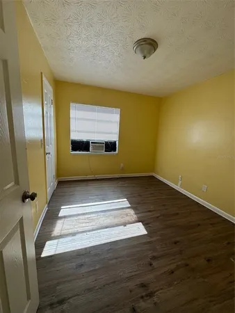 a view of hallway with wooden floor