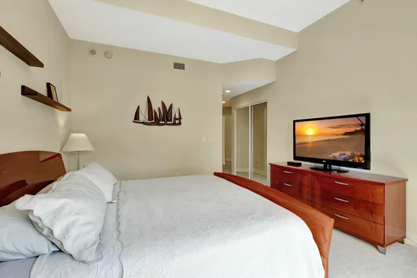 a bedroom with a bed and window