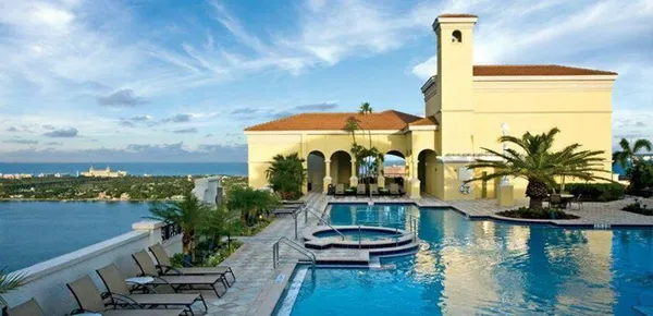 a view of swimming pool with outdoor seating