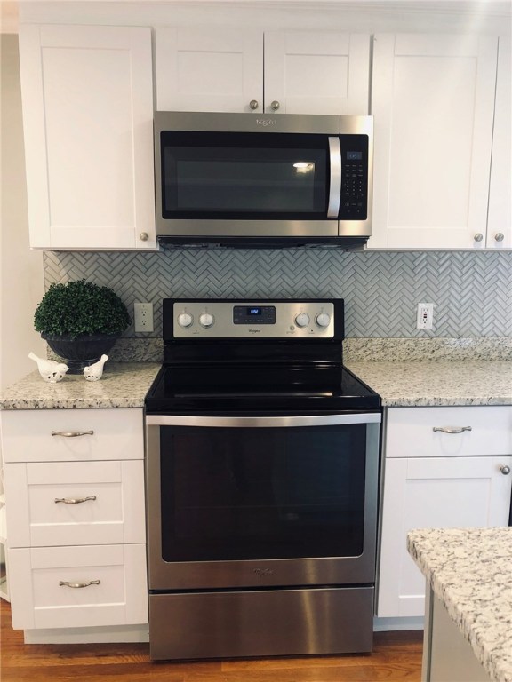 123 Lapham Farm Road Burrillville, RI 02859 - Photo 8 of 40 New white cabinets complimented with a herringbone back splash