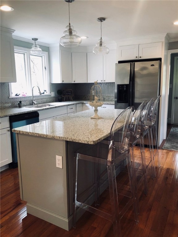 123 Lapham Farm Road Burrillville, RI 02859 - Photo 10 of 40 White kitchen cabinets compliment the soft gray large island.