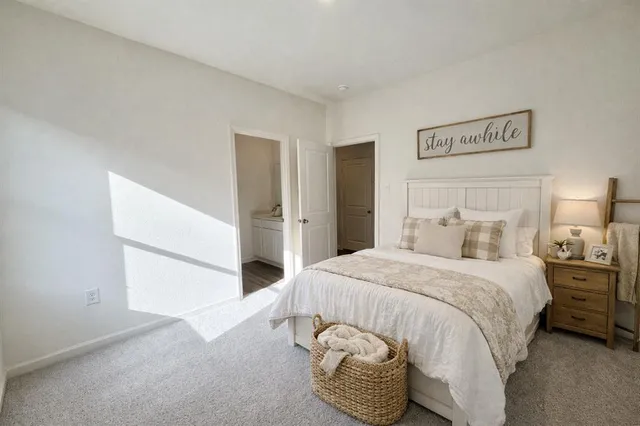 a bedroom with a bed and a cabinets