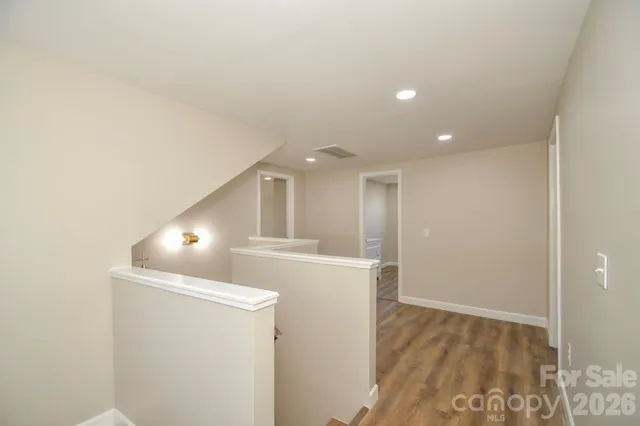 a view of washer and dryer with kitchen in the background