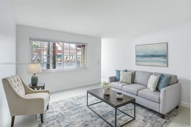 a living room with furniture and a window