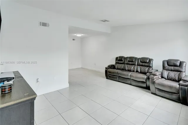 a utility room with sink dryer and washer