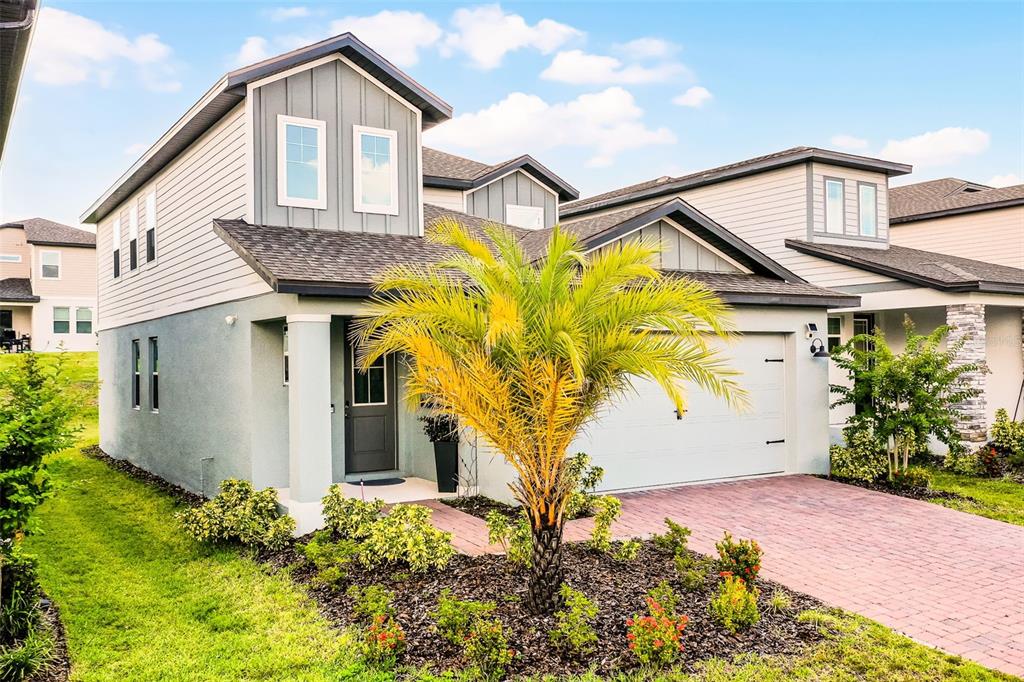 2286 Huntsman Rdg Road Minneola, FL 34715 - Photo 2 of 35 a front view of a house with garden