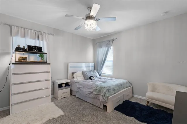 a bedroom with a bed and furniture