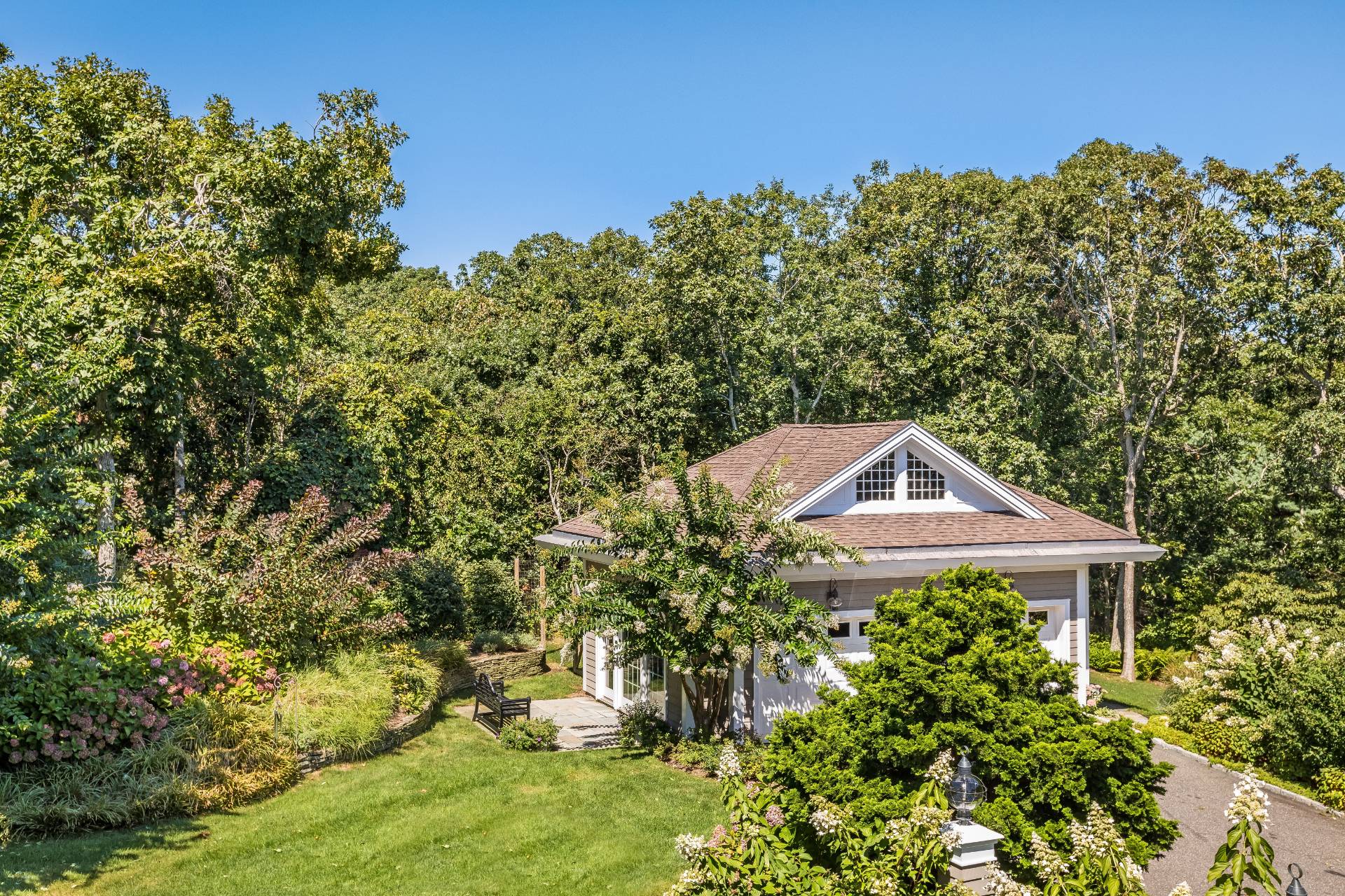 21 Tara Road Montauk, NY 11954 - Photo 30 of 37 a front view of a house with a yard
