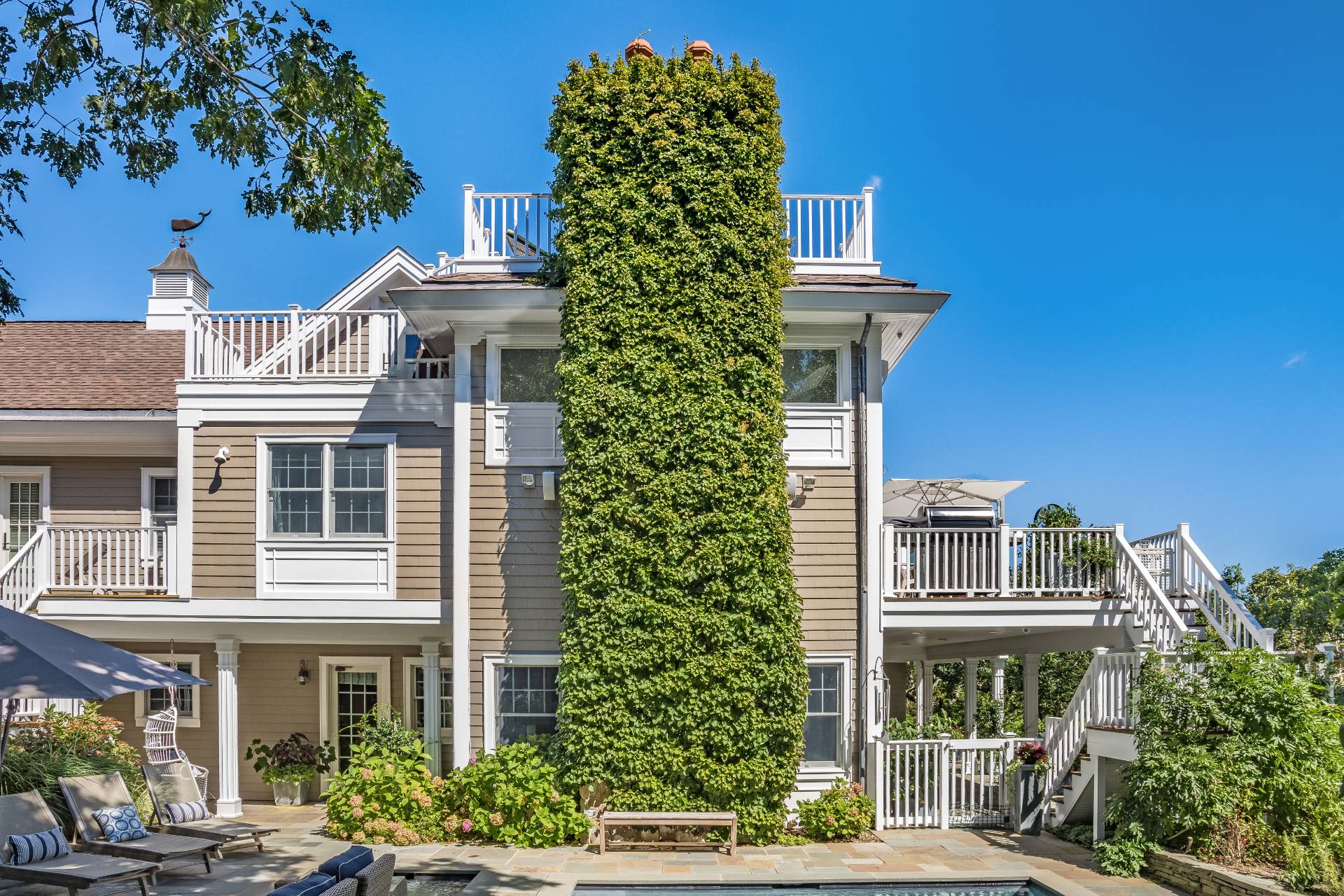 21 Tara Road Montauk, NY 11954 - Photo 33 of 37 a front view of a multi story building