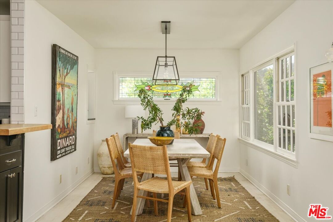 3983 Sunswept Drive Studio City, CA 91604 - Photo 12 of 53 a view of a dining room with furniture window and outside view