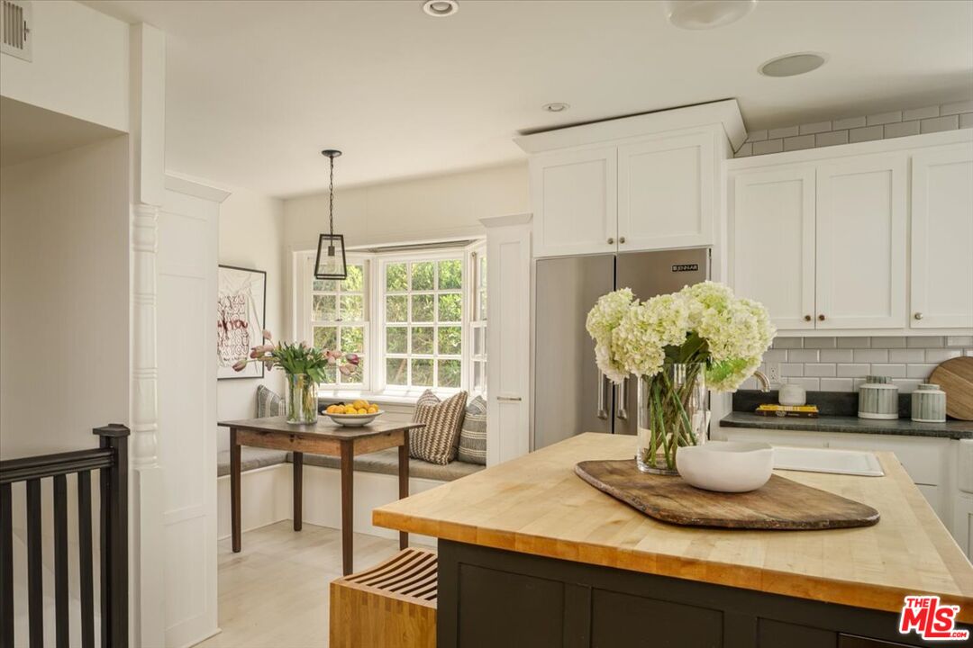 3983 Sunswept Drive Studio City, CA 91604 - Photo 16 of 53 a kitchen with a table and chairs in it