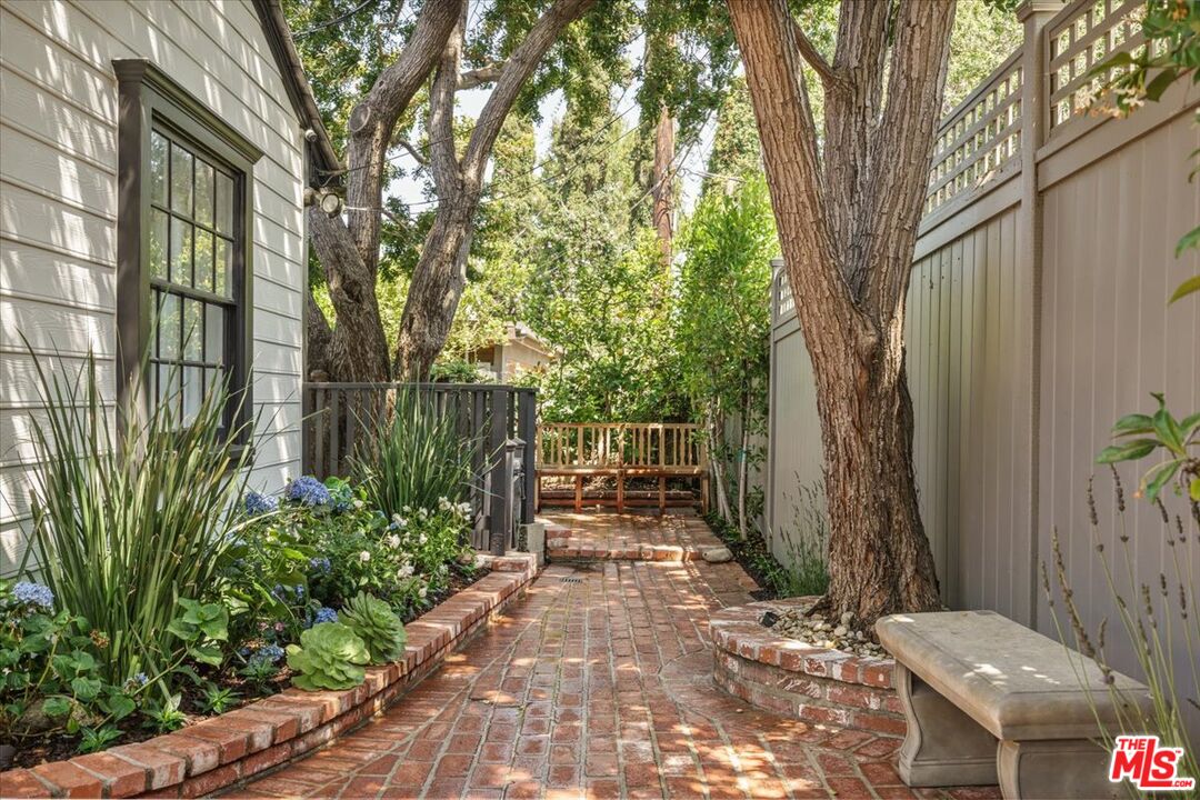 3983 Sunswept Drive Studio City, CA 91604 - Photo 2 of 53 a backyard of a house with lots of green space