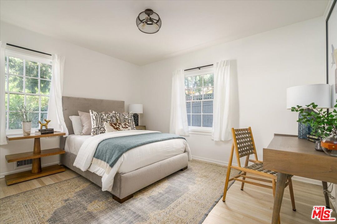 3983 Sunswept Drive Studio City, CA 91604 - Photo 21 of 53 a bed room with a bed and a chair