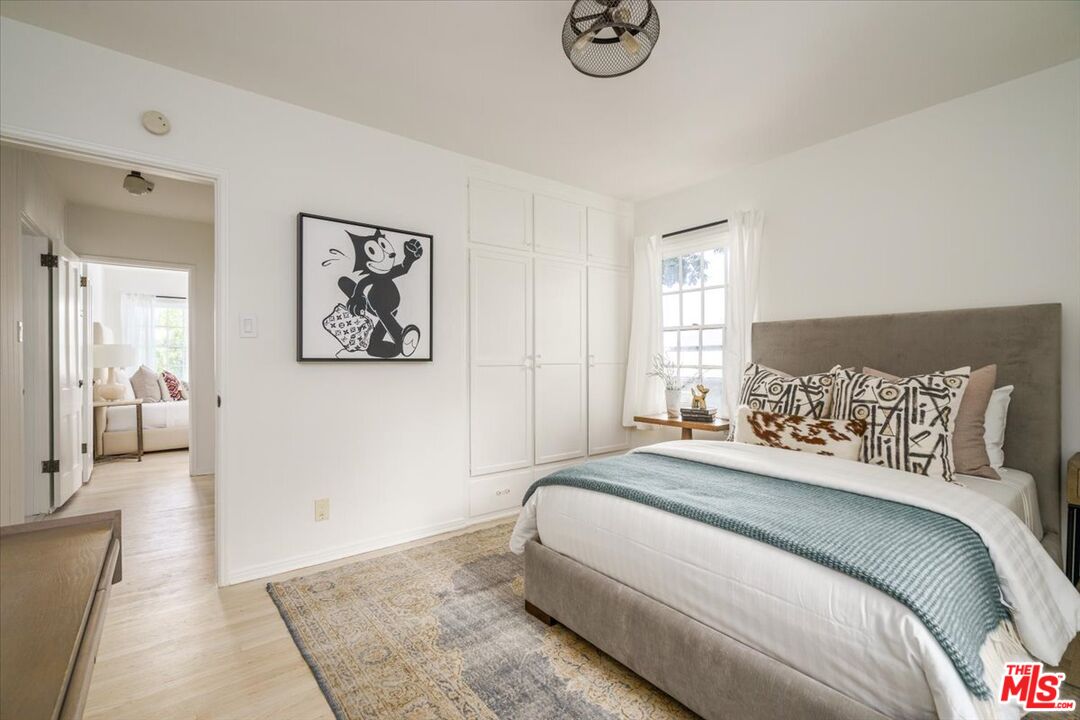 3983 Sunswept Drive Studio City, CA 91604 - Photo 22 of 53 a bedroom with a large bed and a couch