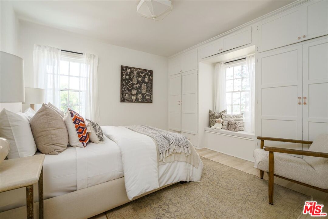 3983 Sunswept Drive Studio City, CA 91604 - Photo 23 of 53 a bedroom with a bed and a window