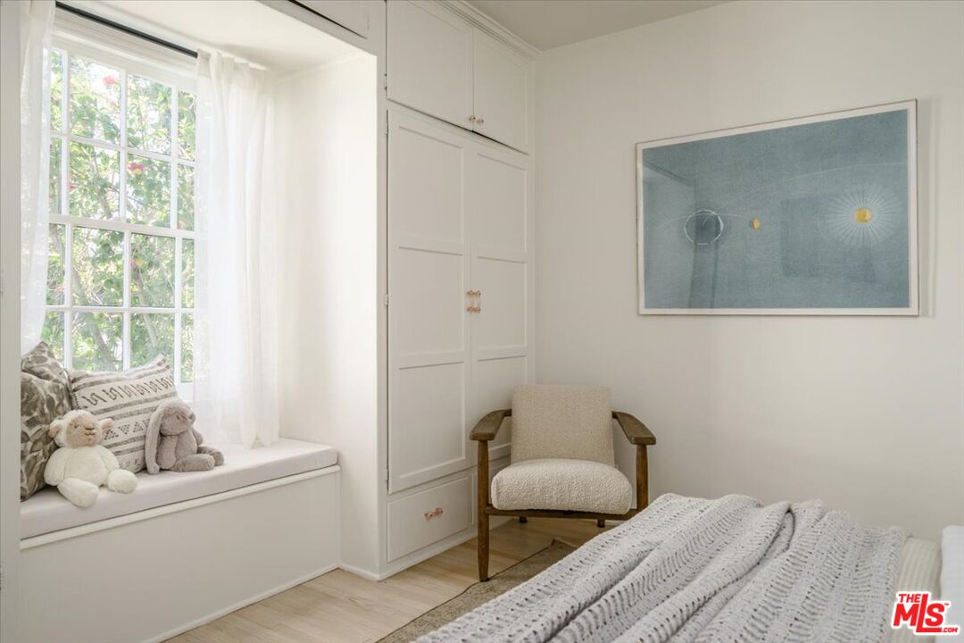 3983 Sunswept Drive Studio City, CA 91604 - Photo 24 of 53 a bedroom with a bed and a couch