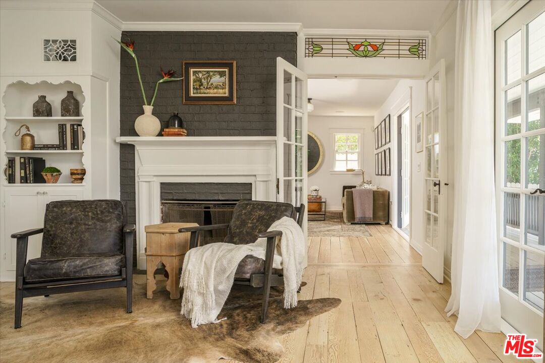 3983 Sunswept Drive Studio City, CA 91604 - Photo 34 of 53 a living room with furniture and a fireplace