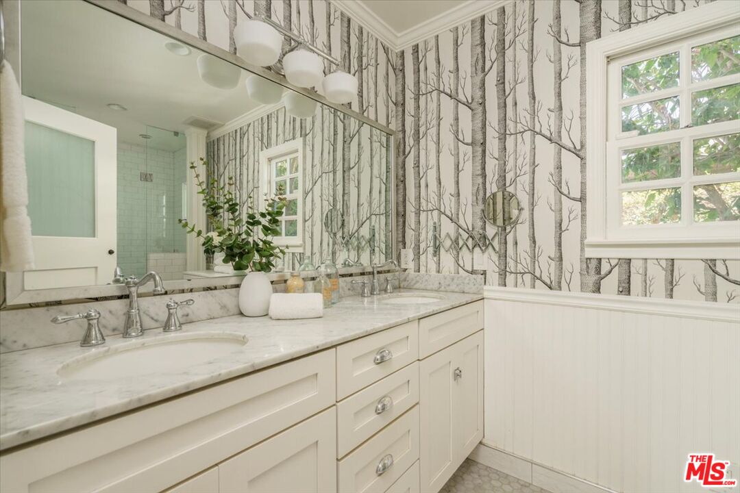 3983 Sunswept Drive Studio City, CA 91604 - Photo 35 of 53 a bathroom with a sink and mirror