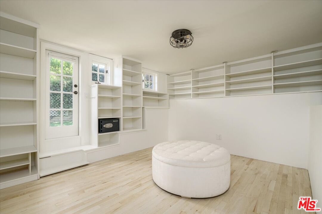 3983 Sunswept Drive Studio City, CA 91604 - Photo 39 of 53 a room with a wooden floor and a large window