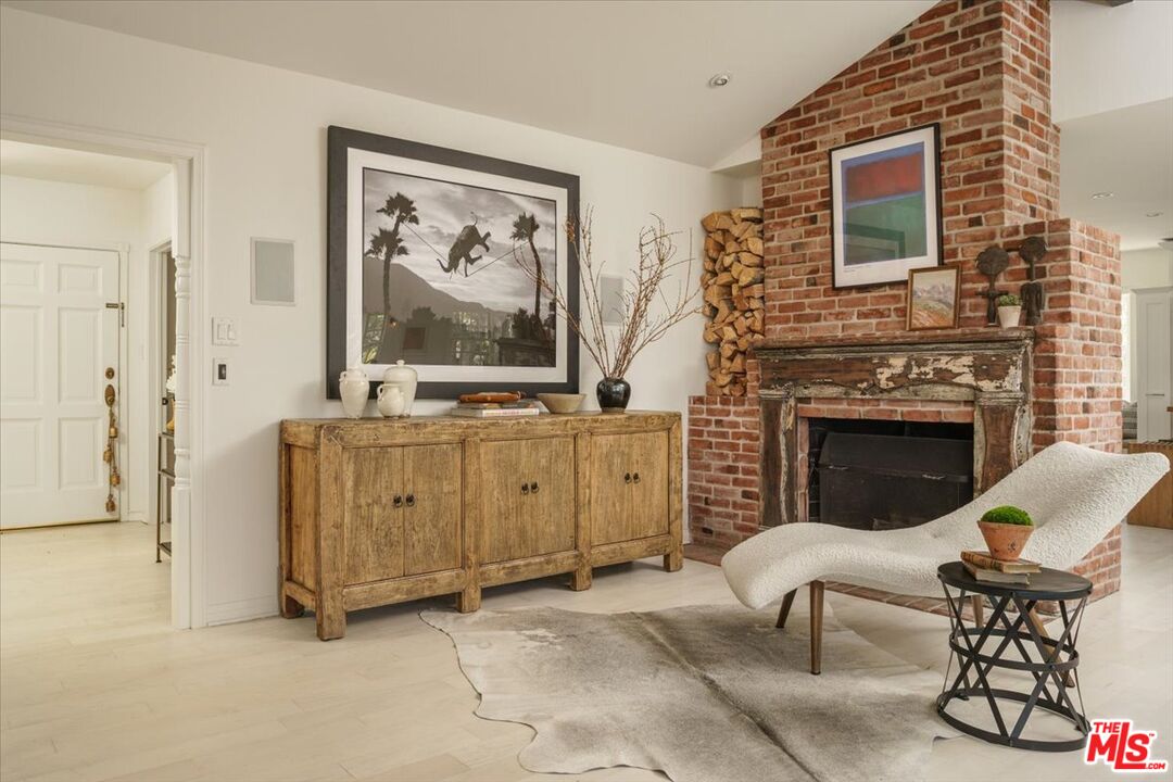 3983 Sunswept Drive Studio City, CA 91604 - Photo 6 of 53 a living room with furniture and a fireplace