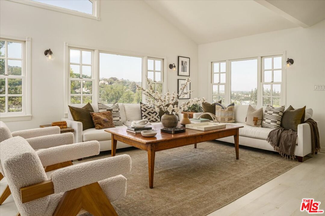 3983 Sunswept Drive Studio City, CA 91604 - Photo 7 of 53 a living room with furniture and a large window
