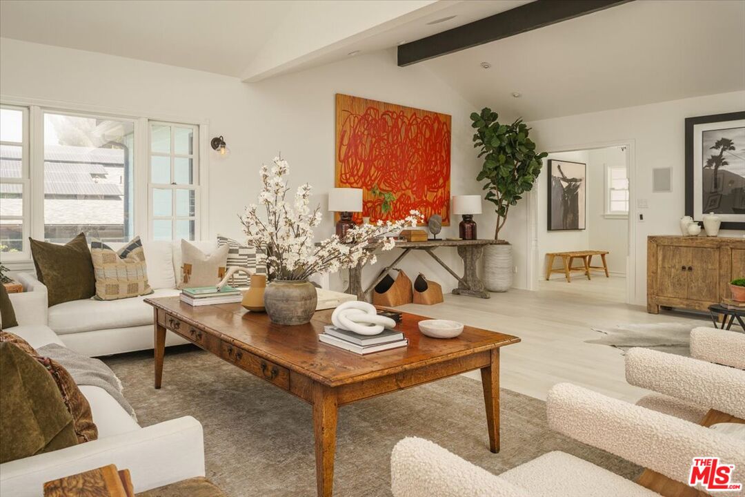 3983 Sunswept Drive Studio City, CA 91604 - Photo 8 of 53 a living room with furniture and a large window