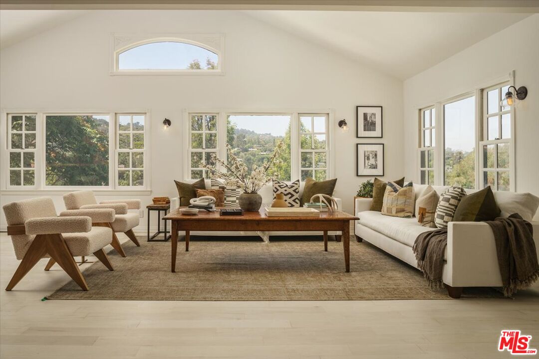 3983 Sunswept Drive Studio City, CA 91604 - Photo 9 of 53 a living room with furniture and a large window