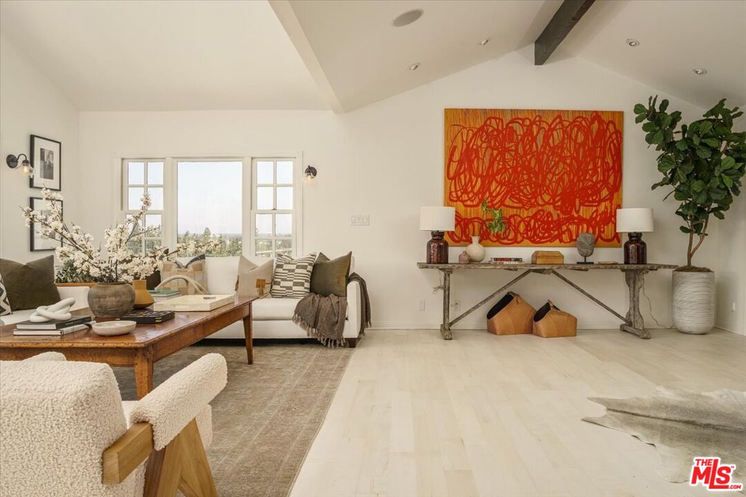 3983 Sunswept Drive Studio City, CA 91604 - Photo 10 of 53 a living room with furniture and a flat screen tv