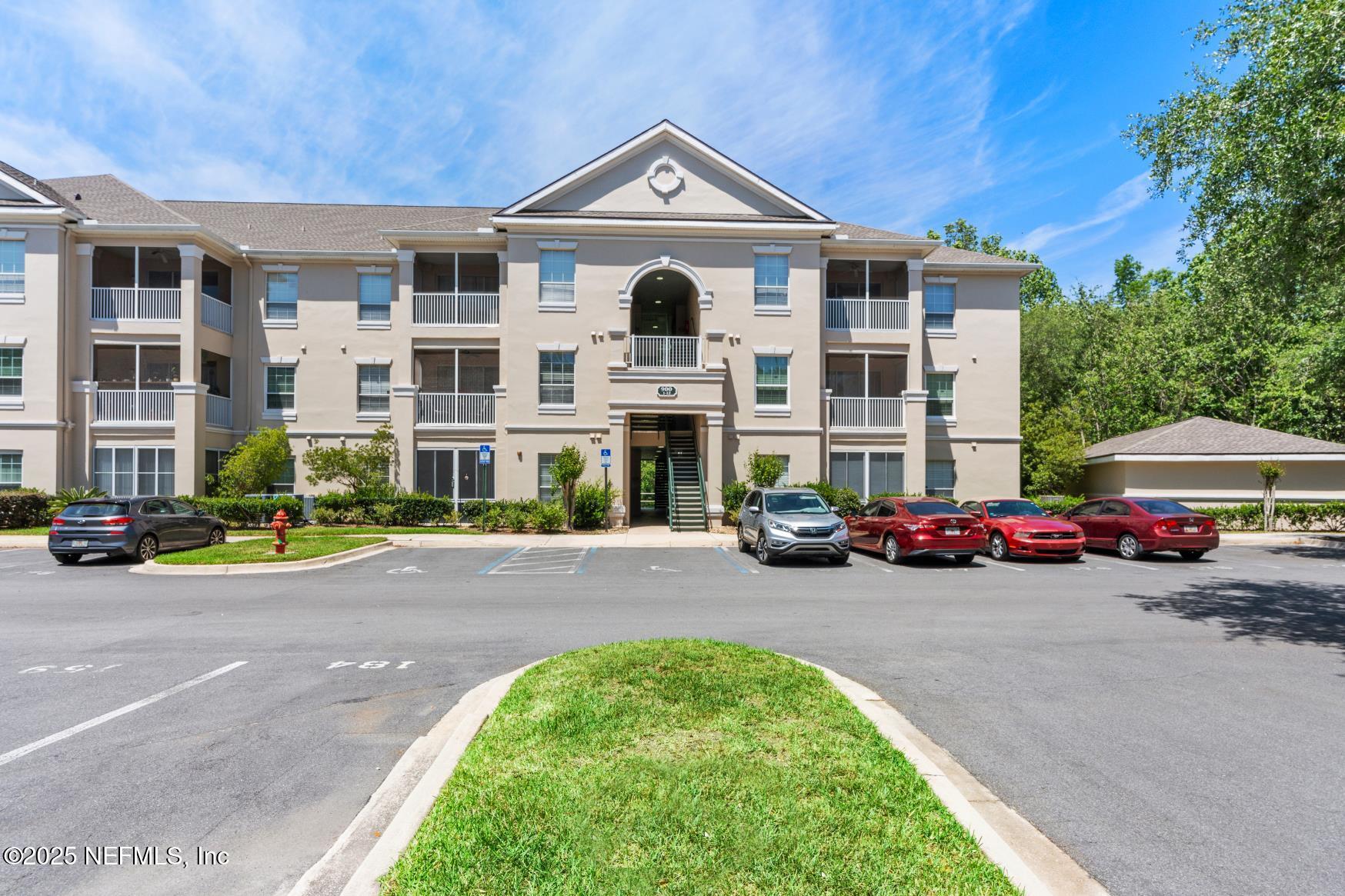 8601 Beach Boulevard, Unit 905 Jacksonville, FL 32216 - Photo 2 of 27 a view of a street with cars parked in front of it