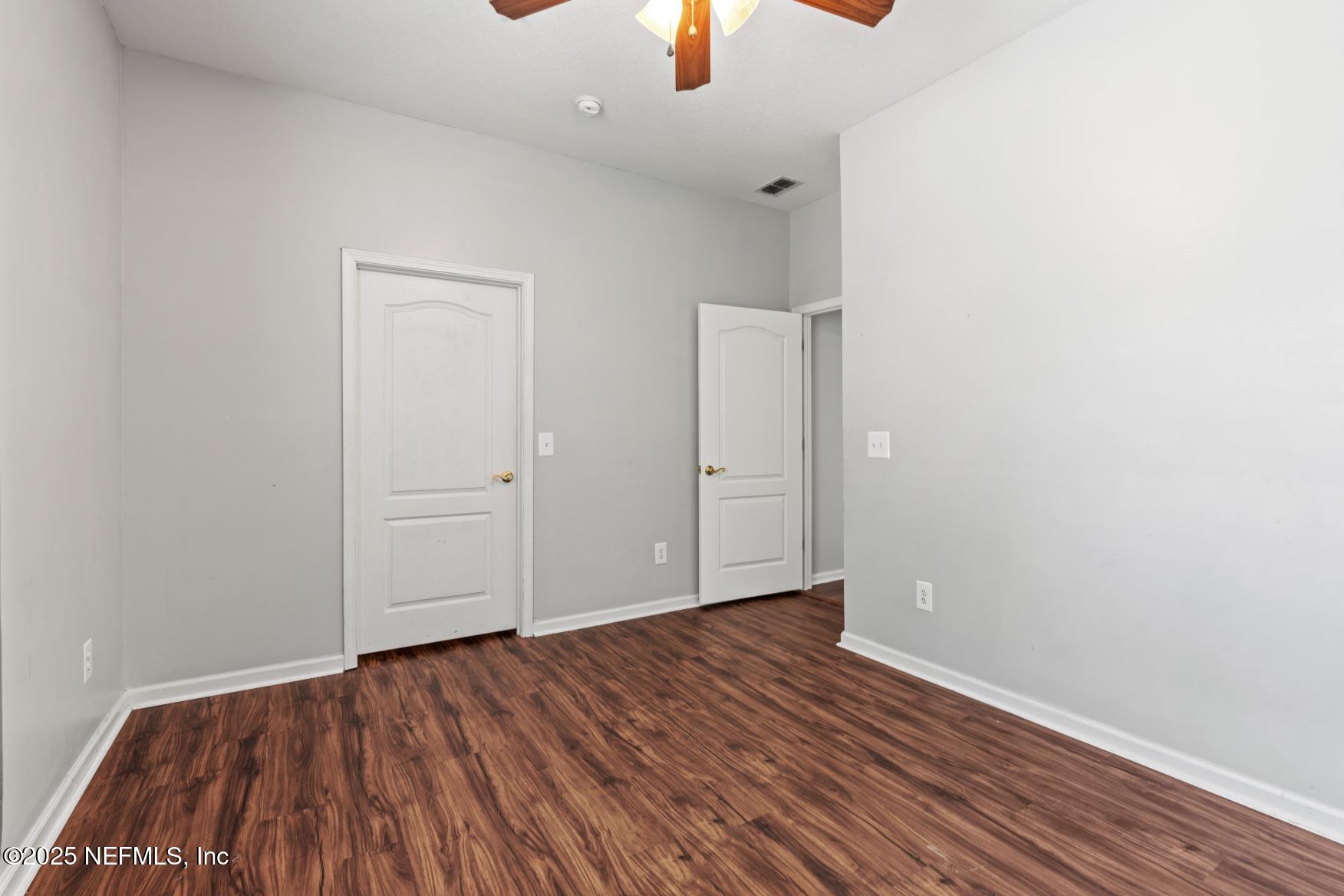 8601 Beach Boulevard, Unit 905 Jacksonville, FL 32216 - Photo 21 of 27 wooden floor in an empty room