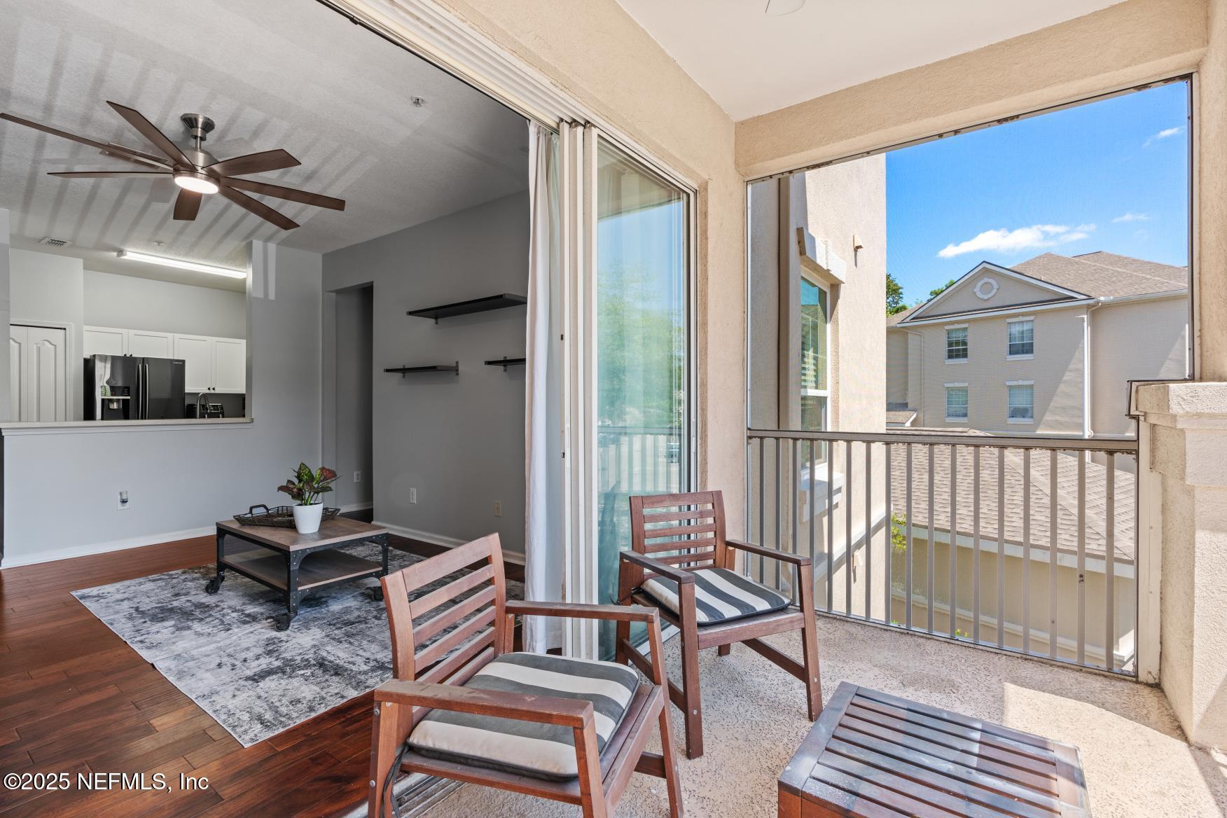 8601 Beach Boulevard, Unit 905 Jacksonville, FL 32216 - Photo 23 of 27 a living room with furniture and a window