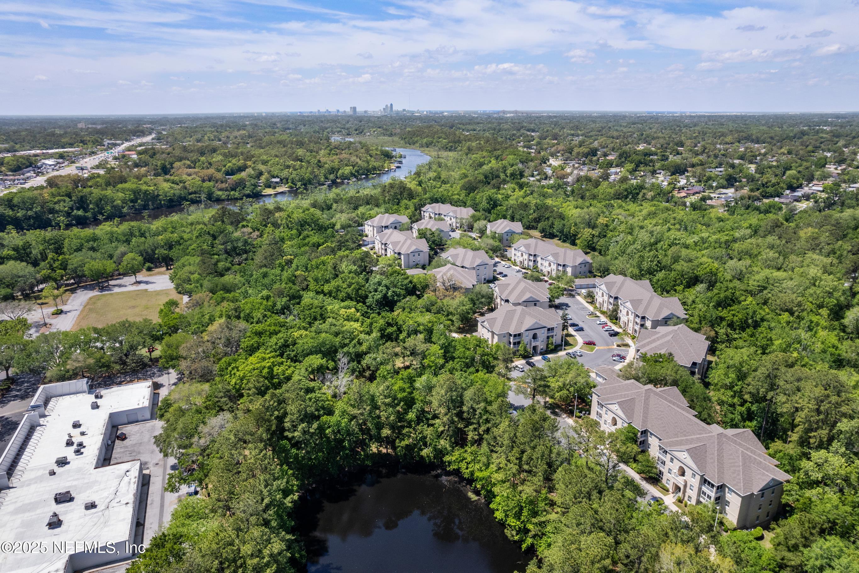 8601 Beach Boulevard, Unit 905 Jacksonville, FL 32216 - Photo 25 of 27 an aerial view of a city with lots of residential buildings