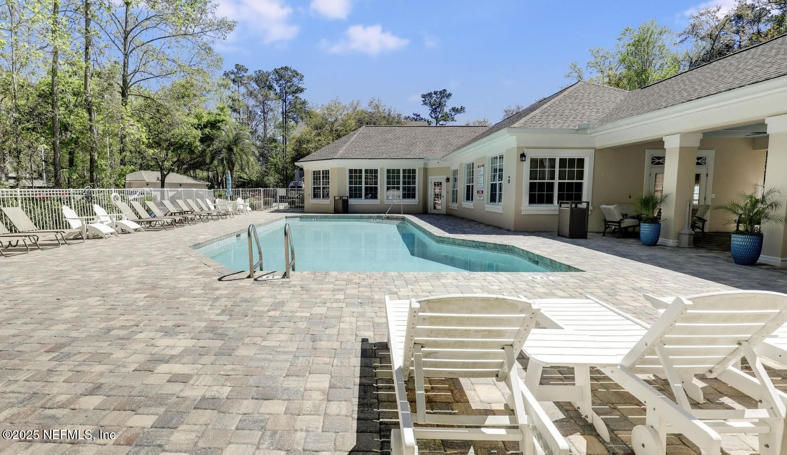 8601 Beach Boulevard, Unit 905 Jacksonville, FL 32216 - Photo 26 of 27 a front view of a house with a yard
