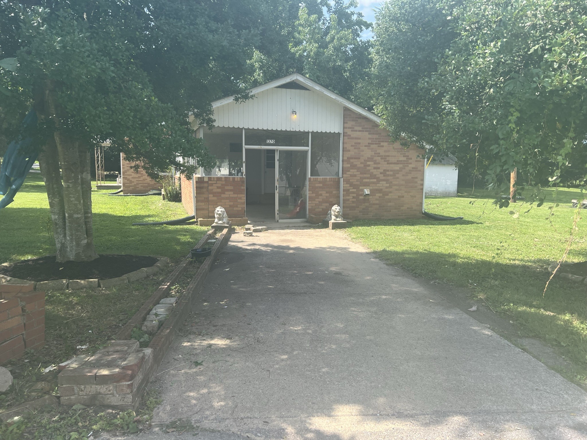 1400 Old Dover Road Clarksville, TN 37042 - Photo 10 of 65 a front view of a house with a yard and a garage