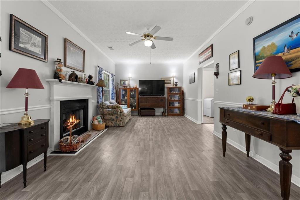 525 Michael Circle Monroe, GA 30655 - Photo 13 of 42 a living room with furniture and a fireplace