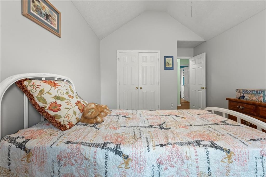 525 Michael Circle Monroe, GA 30655 - Photo 20 of 42 a bedroom with a bed and a mirror