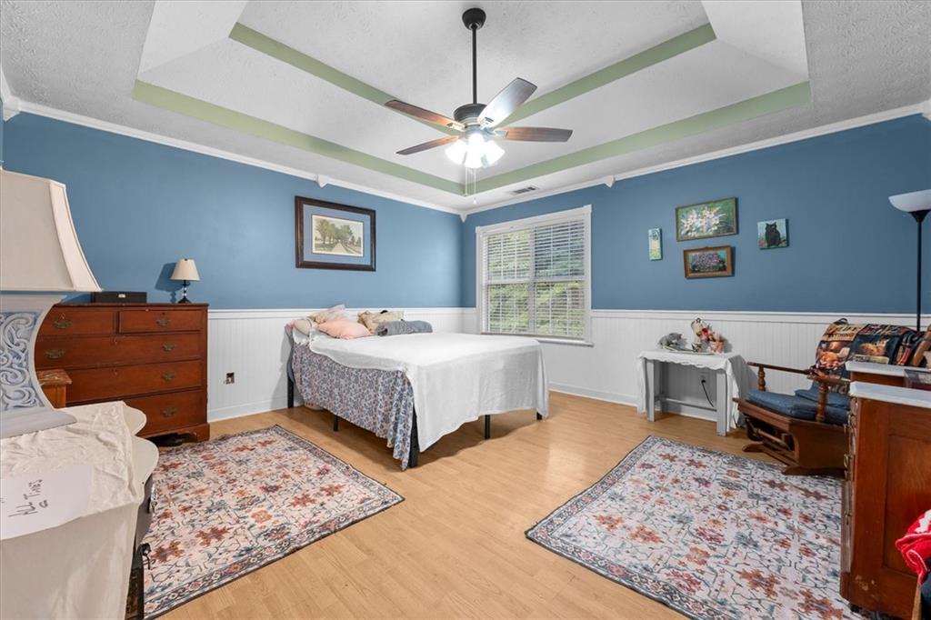 525 Michael Circle Monroe, GA 30655 - Photo 25 of 42 a bedroom with a bed and dresser