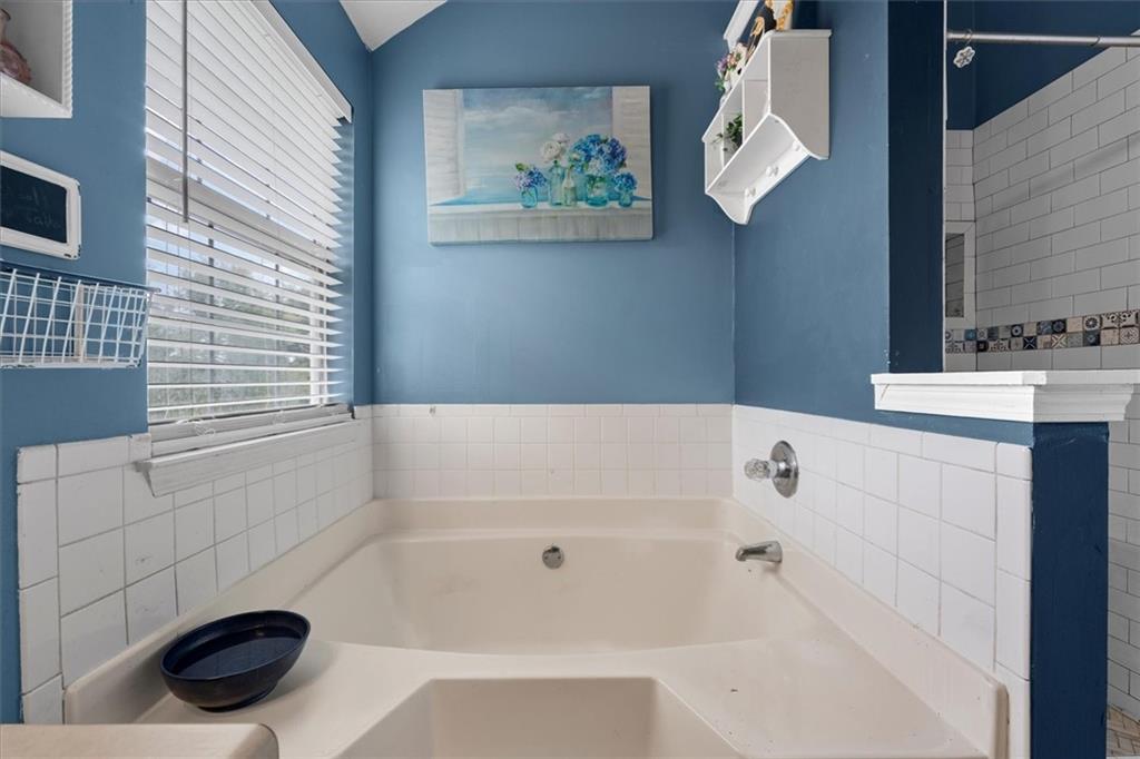 525 Michael Circle Monroe, GA 30655 - Photo 29 of 42 a bathroom with a bathtub and a sink