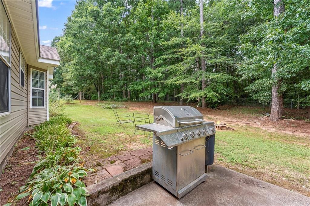 525 Michael Circle Monroe, GA 30655 - Photo 31 of 42 a view of a backyard with trees