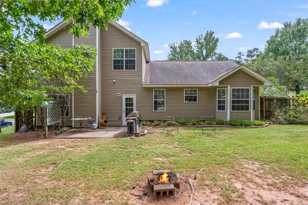 525 Michael Circle Monroe, GA 30655 - Photo 34 of 42 a backyard of a house with seating space