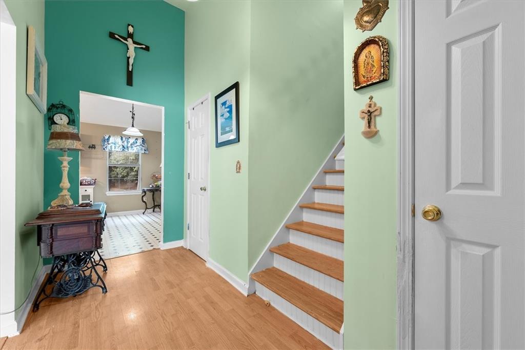 525 Michael Circle Monroe, GA 30655 - Photo 5 of 42 a view of a hallway with wooden floor and windows