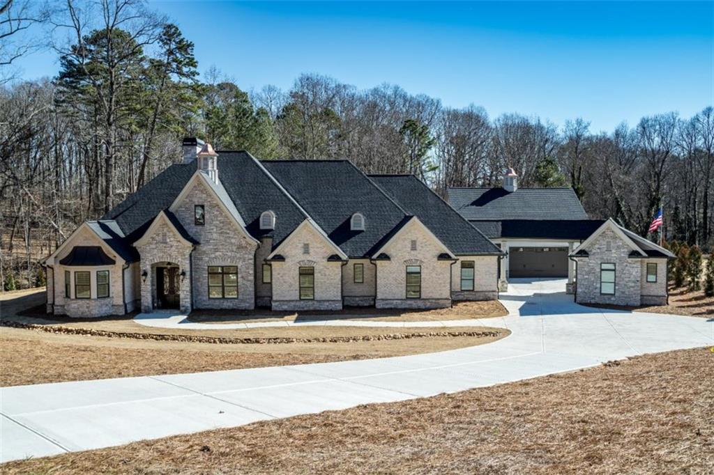 3 Cox Road Roswell, GA 30075 - Photo 15 of 37 a front view of a house with a yard and trees