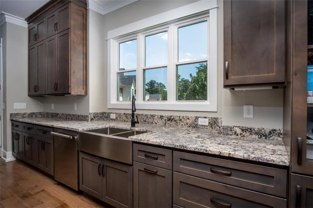 3 Cox Road Roswell, GA 30075 - Photo 18 of 37 a kitchen with granite countertop a sink and a window