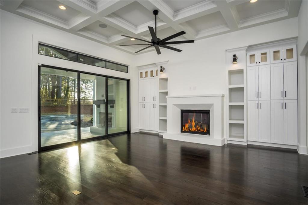 3 Cox Road Roswell, GA 30075 - Photo 3 of 38 a view of a livingroom with a fireplace wooden floor and window