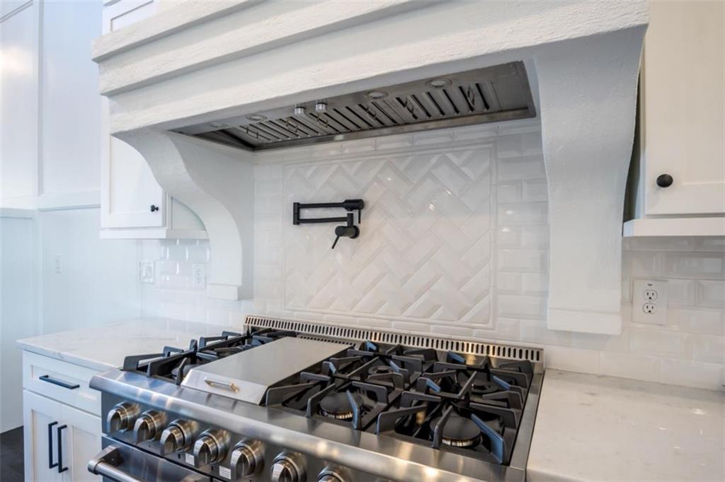 3 Cox Road Roswell, GA 30075 - Photo 5 of 38 a close view of a stove top oven