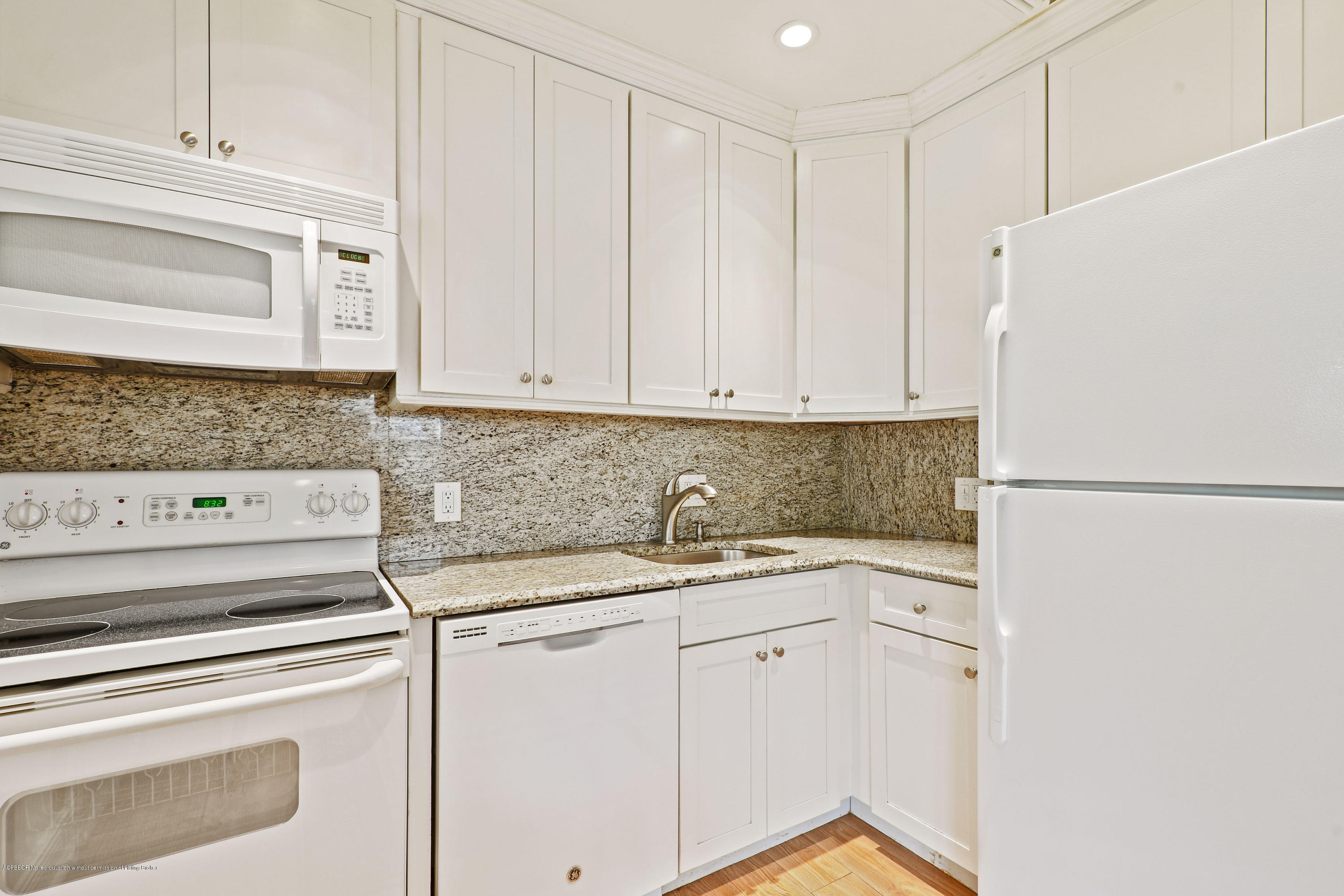 341 Murray Road West Palm Beach, FL 33405 - Photo 11 of 25 a kitchen with a sink cabinets and appliances