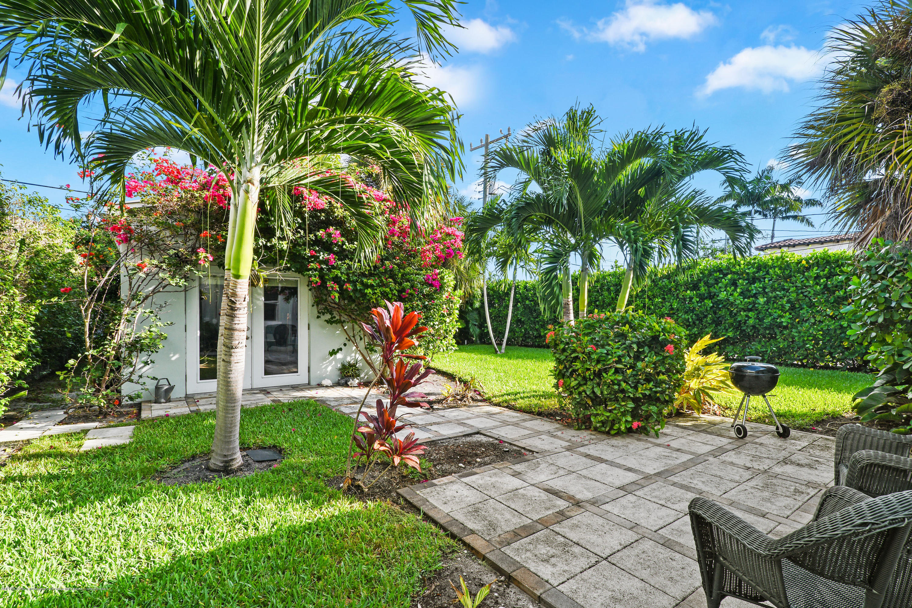 341 Murray Road West Palm Beach, FL 33405 - Photo 17 of 25 a view of a backyard with plants and a slide